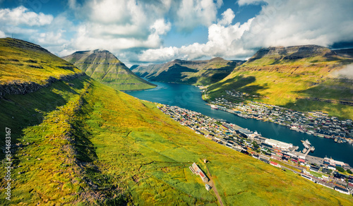 View from flying drone of second biggest city of Faroe islands - Klaksvik. Aerial morning scene of Bordoy island, Denmark, Europe. Traveling concept background. photo