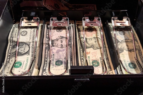 Cash drawer full of American money 
