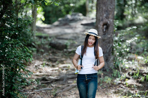 Lifestyle beautiful woman happy torist to travel in wild trip hiking during vacation.Travel Concept. photo