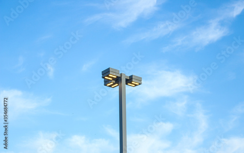A lantern in the street against a blue sky