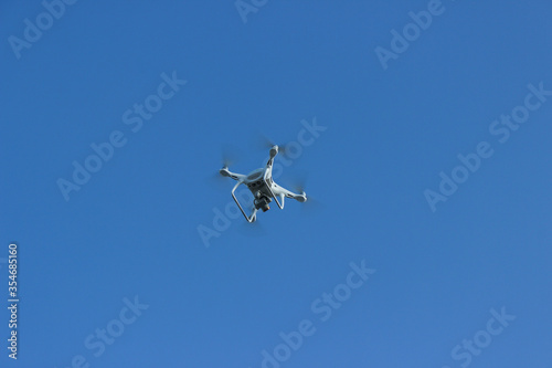 Quadrocopter in the sky to shoot video