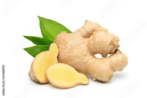 Quadro su tela Fresh ginger rhizome with sliced and green leaves isolated on white background
