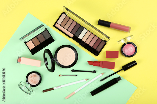 professional makeup tools. Makeup products on plain background top view. A set of various items for makeup.