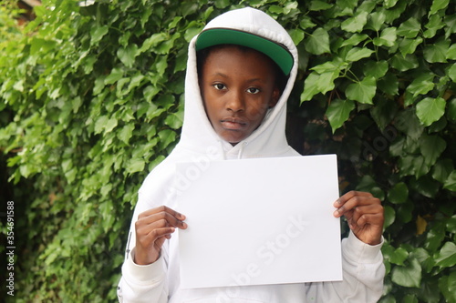 Kid holding Black white paper photo