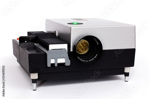 Fotografie Old dia film projector on white, Vintage slide projector with film holder
