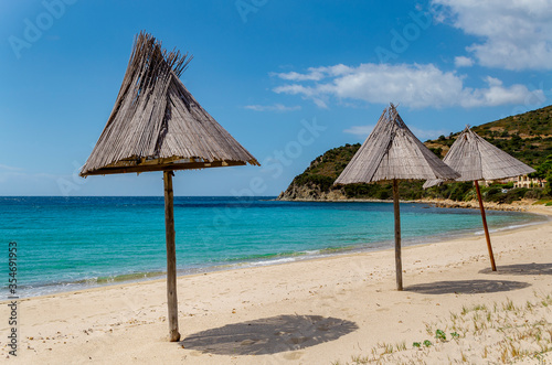 Beach umbrellas near Cagliari  Sardinia  Italy .