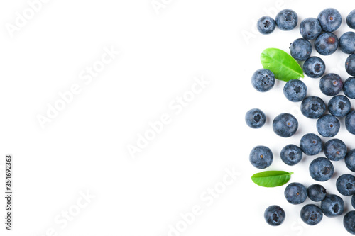blueberry berries with green leaves on white background top view with copy space