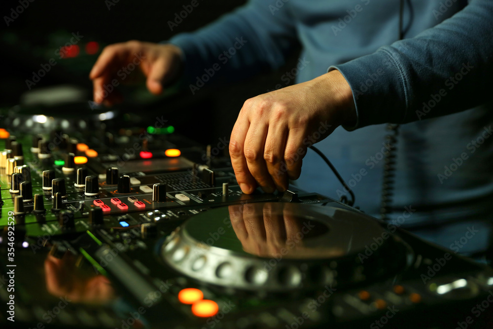 dj's hands are mixing music on digital turntable close up dj's hands are mixing music on digital turntable close up
