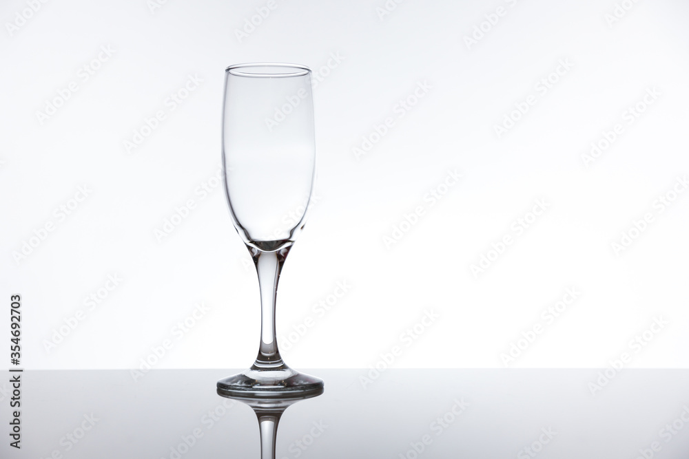 Obraz premium empty transparent wine glass on white background