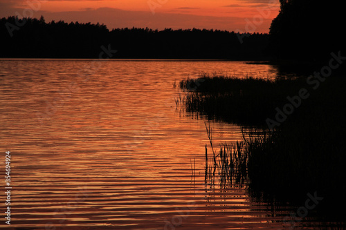 Sunset over Mikaszewo lake in Augustow Primeval Forest, Suwalki Region in Poland