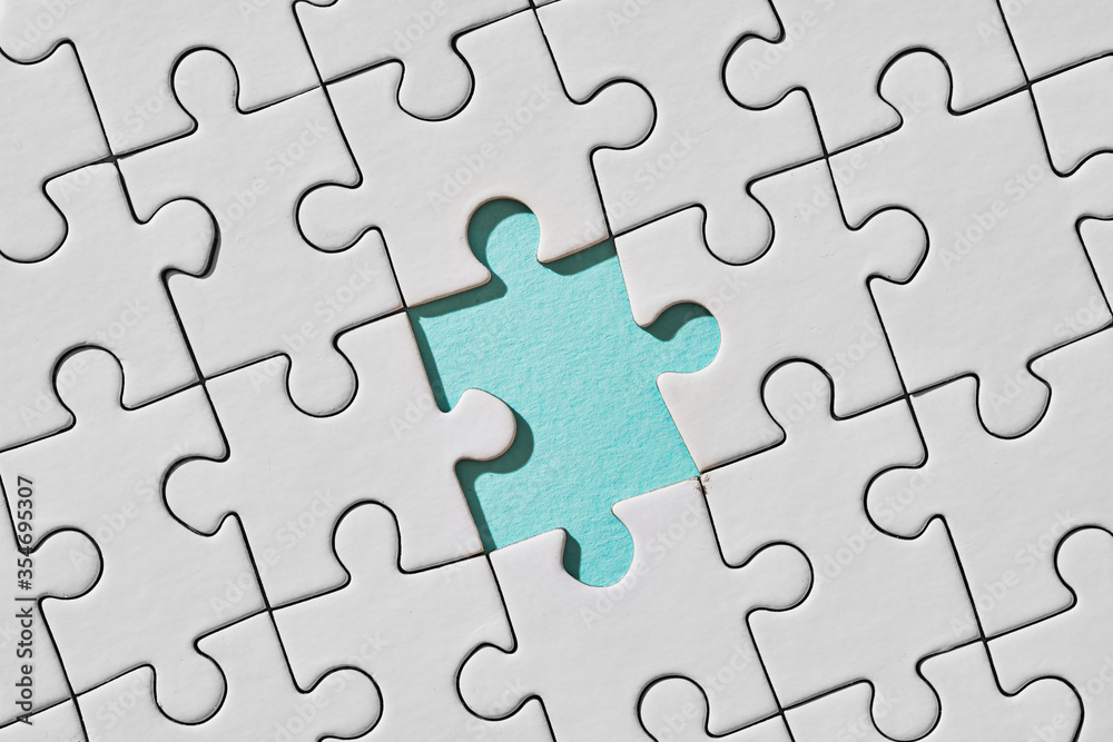 Background of white puzzle with missing piece Background of white puzzle with missing piece