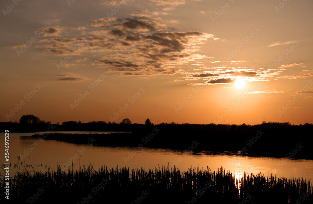 Sunset on the Biebrza river in Biebrza National Park, Poland Sunset on the Biebrza river in Biebrza National Park, Poland