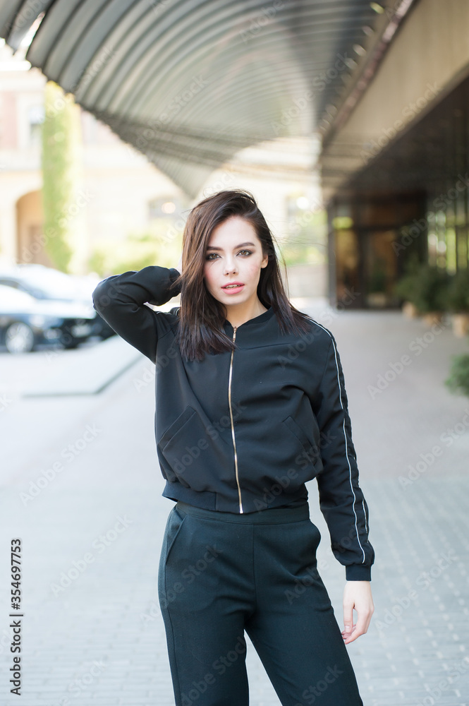 Young beautiful modern woman outdoors with expressive makeup