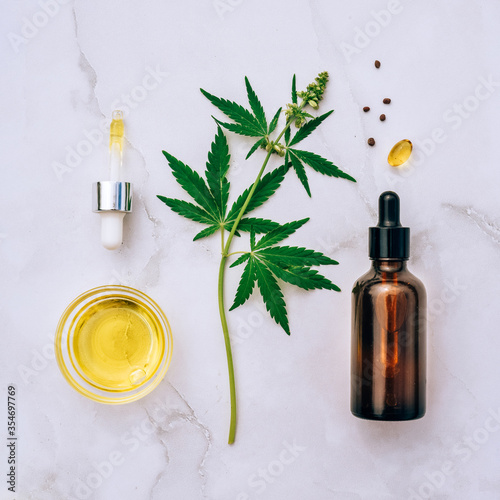 Medical marijuana cannabis cbd oil. CBD oil hemp products. Macro detail of dropper with CBD oil  cannabis live resin extraction on white background. Medical marijuana concept
