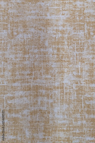 A close-up of a Safavieh Adirondack Keighley area rug with a cream and gold abstract pattern. The power-loomed rug is crafted from enhanced polypropylene yarns. 