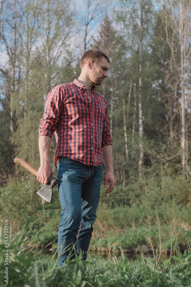 Fototapeta premium man came to the rivers and makes a fire