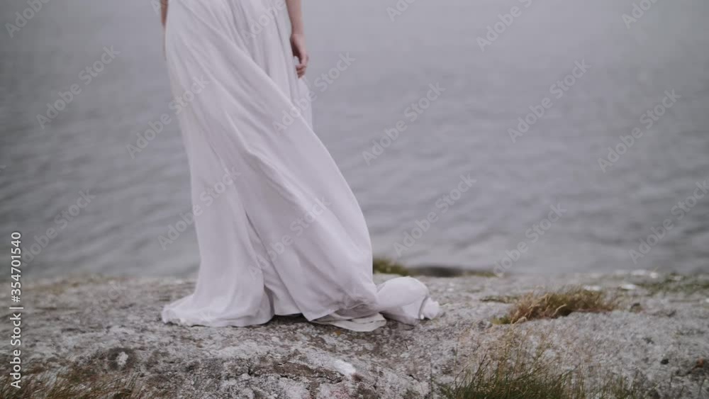 girl in a dress on a background of mountains girl with black hair