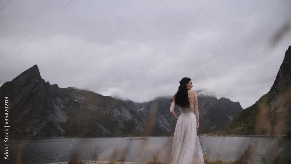 girl in a dress on a background of mountains girl with black hair girl in a dress on a background of mountains girl with black hair