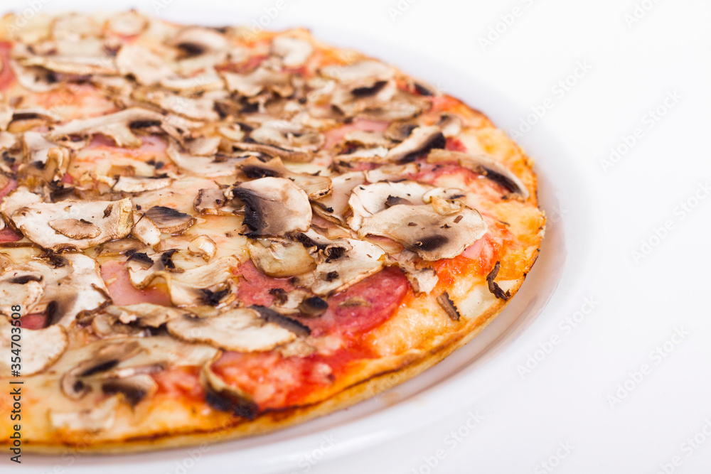 Pizza with salami and mushrooms on a white background up close