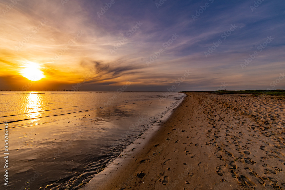 Sunset on the North Sea beach in East Frisia in early summer