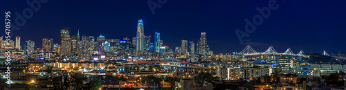 San Francisco skyline night panorama with city lights, the Bay Bridge and light trails on the highway © SvetlanaSF