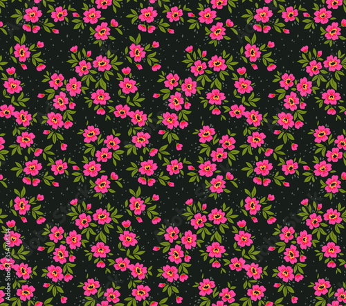 Floral pattern. Pretty flowers on black background. Printing with small pink flowers. Ditsy print. Seamless vector texture. Spring bouquet.