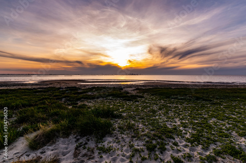 Sunset on the North Sea beach in East Frisia in early summer