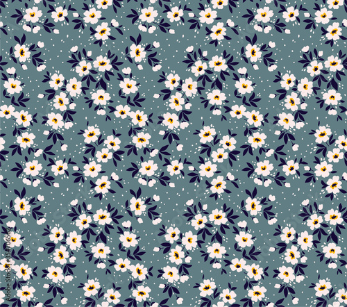 Vintage floral background. Seamless vector pattern for design and fashion prints. Flowers pattern with small white flowers on a gray background. Ditsy style.