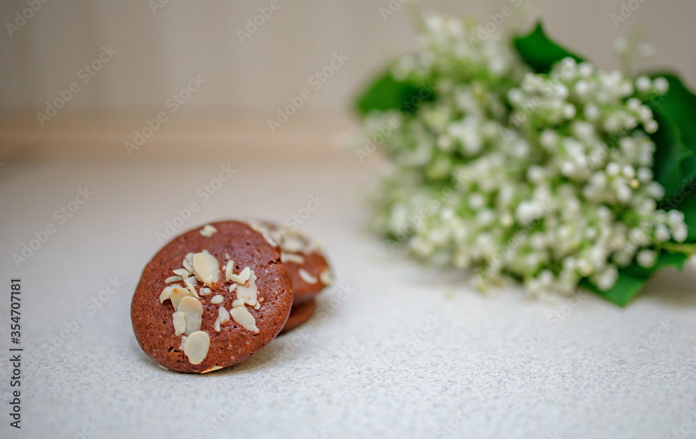 Chocolate biscuits with nuts against the background of the lizard Chocolate biscuits with nuts against the background of the lizard