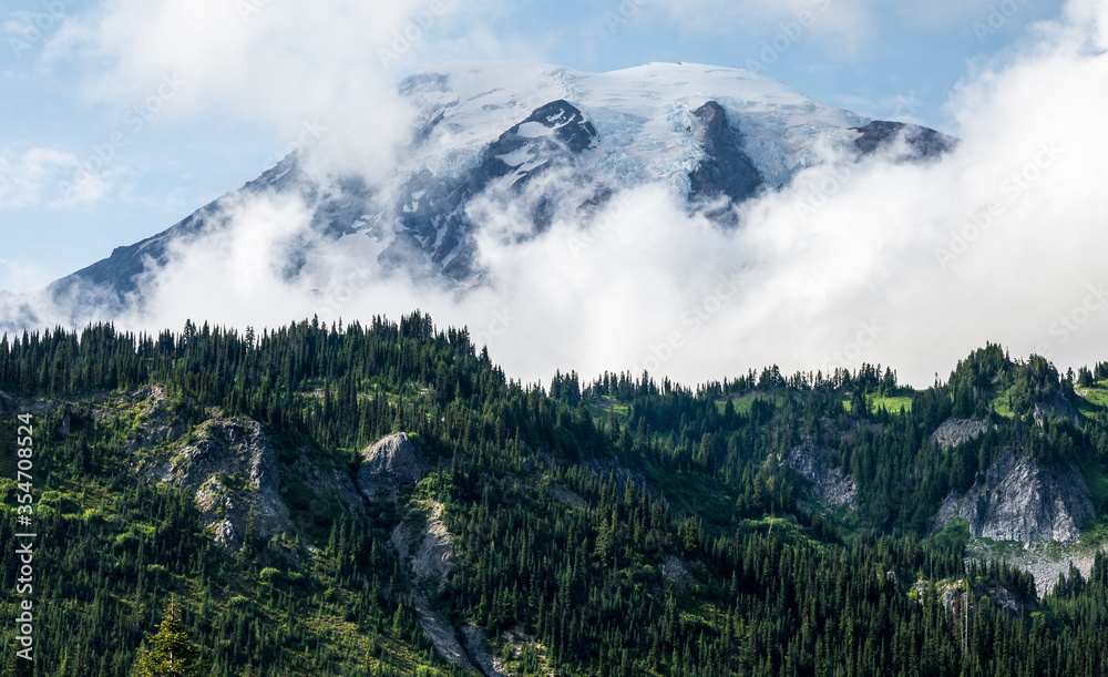Clouds passing by Mount Rainier in Mount Rainier National Park | Washington