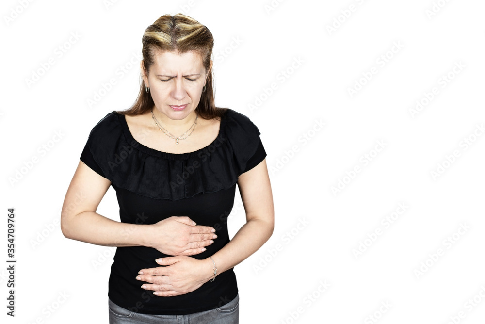 Middle-aged woman suffering from abdominal pain on a white background, isolated. The woman is holding on to her stomach because her menstrual days have begun