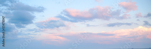 bright sky with pink and white clouds for background