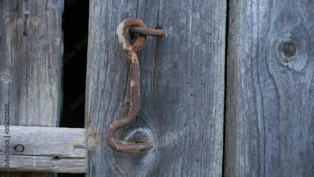 Dangling hook of wooden door. Loop 