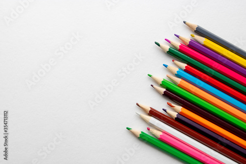 Colour pencils isolated on white background close up.space for text