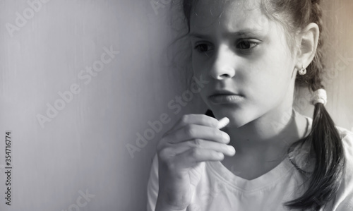 Teenage girl takes medicine during illness. Home treatment.