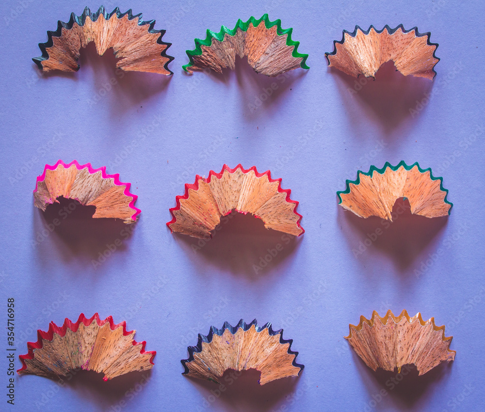 Pencil shavings arranged in rows and columns.