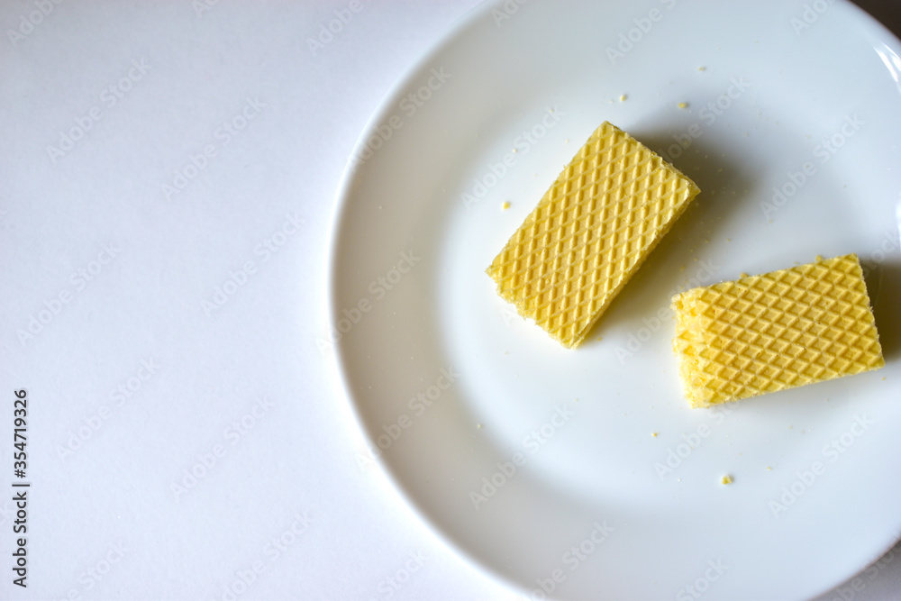 Some delicious sugar waffles on a white plate Some delicious sugar waffles on a white plate