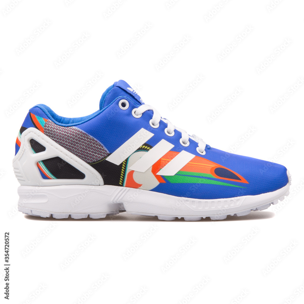 VIENNA, AUSTRIA - AUGUST 10, 2017: Adidas ZX Flux blue, white and multi  color sneaker on white background. Stock Photo | Adobe Stock