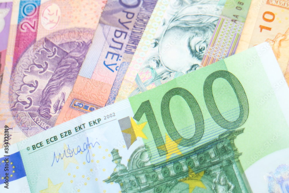 A 100 Euro banknote arranged over a rainbow of banknotes of different world currencies, including Australian Dollars, Israeli Shekels, South African Rand and Polish Złoty. A 100 Euro banknote arranged over a rainbow of banknotes of different world currencies, including Australian Dollars, Israeli Shekels, South African Rand and Polish Złoty.