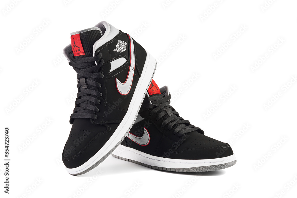 VIENNA, AUSTRIA - MAY 10, 2019: Nike Air Jordan 1 Mid black, grey, red and  white sneakers on white background. Stock-Foto | Adobe Stock