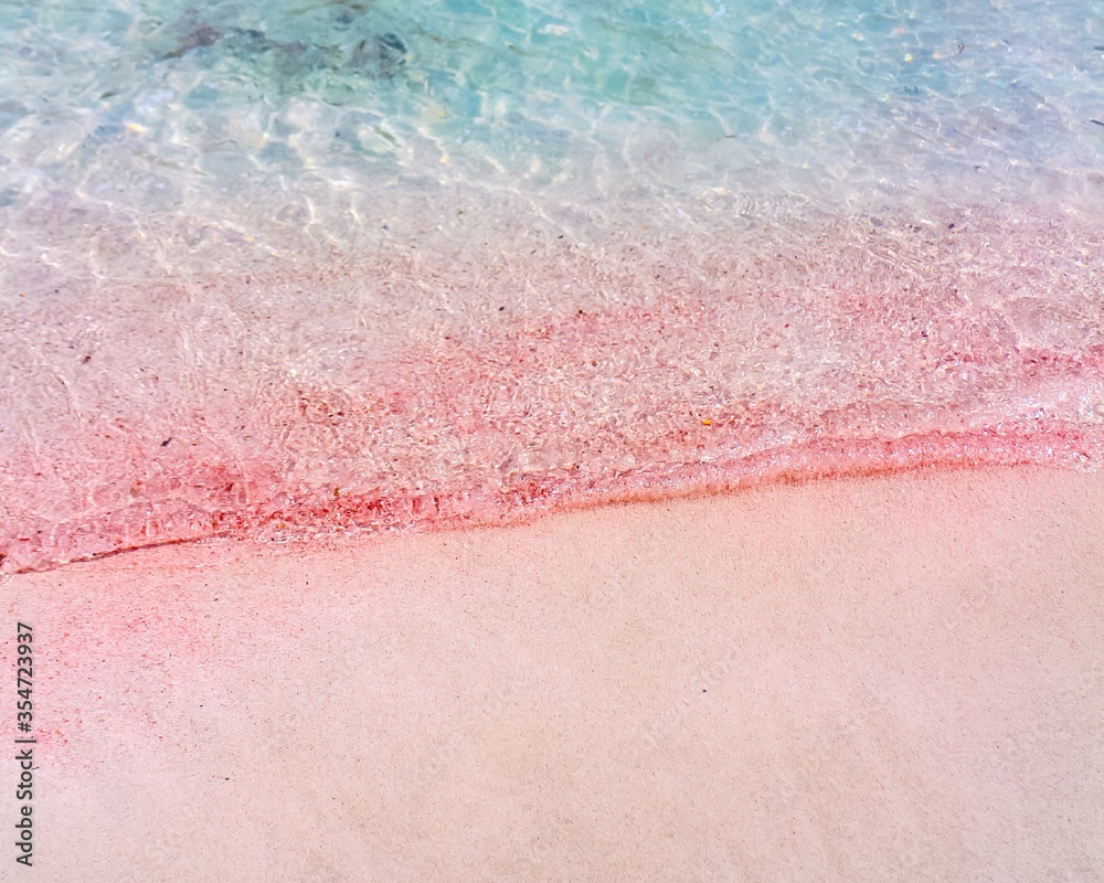 Pink sand with the turquoise waters of the Mediterranean Sea, seen at Balos Beach, Crete, Greece.