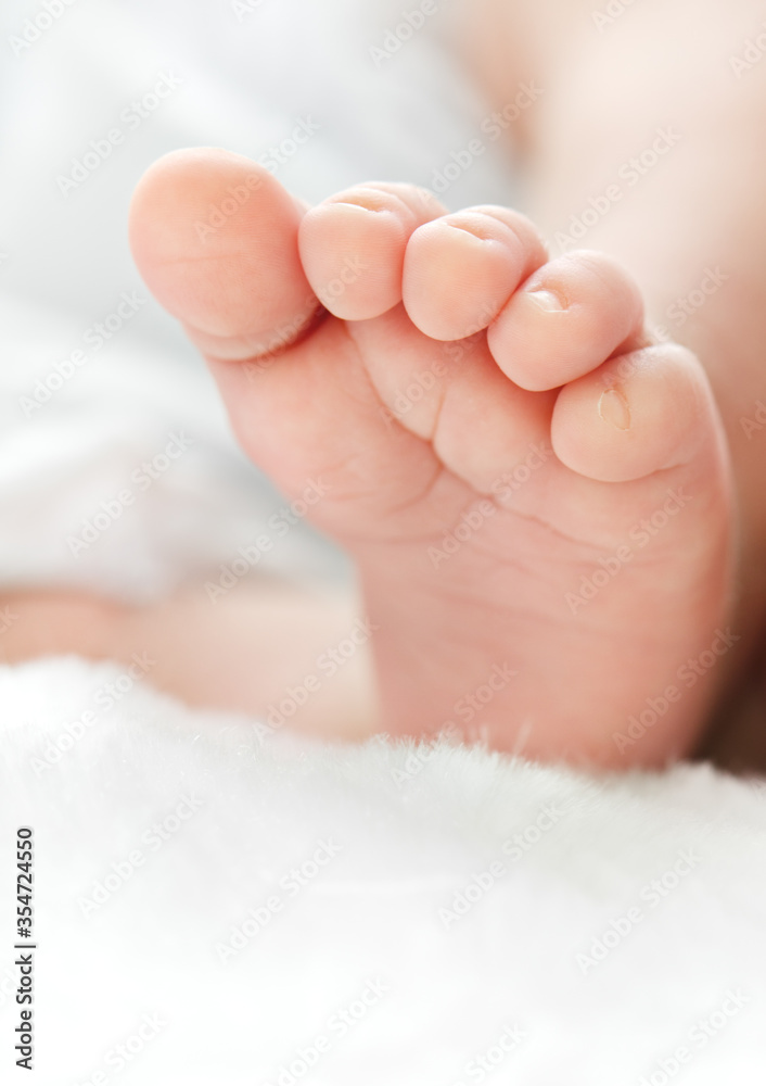 Newborn's foot on white blanket for your a baby shower card Newborn's foot on white blanket for your a baby shower card