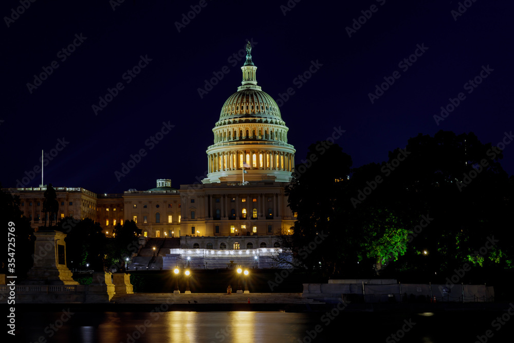 Panoramic image of the Capital of the United States with the capital pool in light.