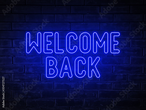Welcome back - blue neon light word on brick wall background