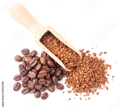 Granulated coffee in a spatula and coffee beans on a white background, isolated. The view from top