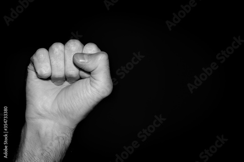 Fist isolated on black background. Political movement minorities. Human rights demonstration. Revolution USA. Police brutality stop. Copy space