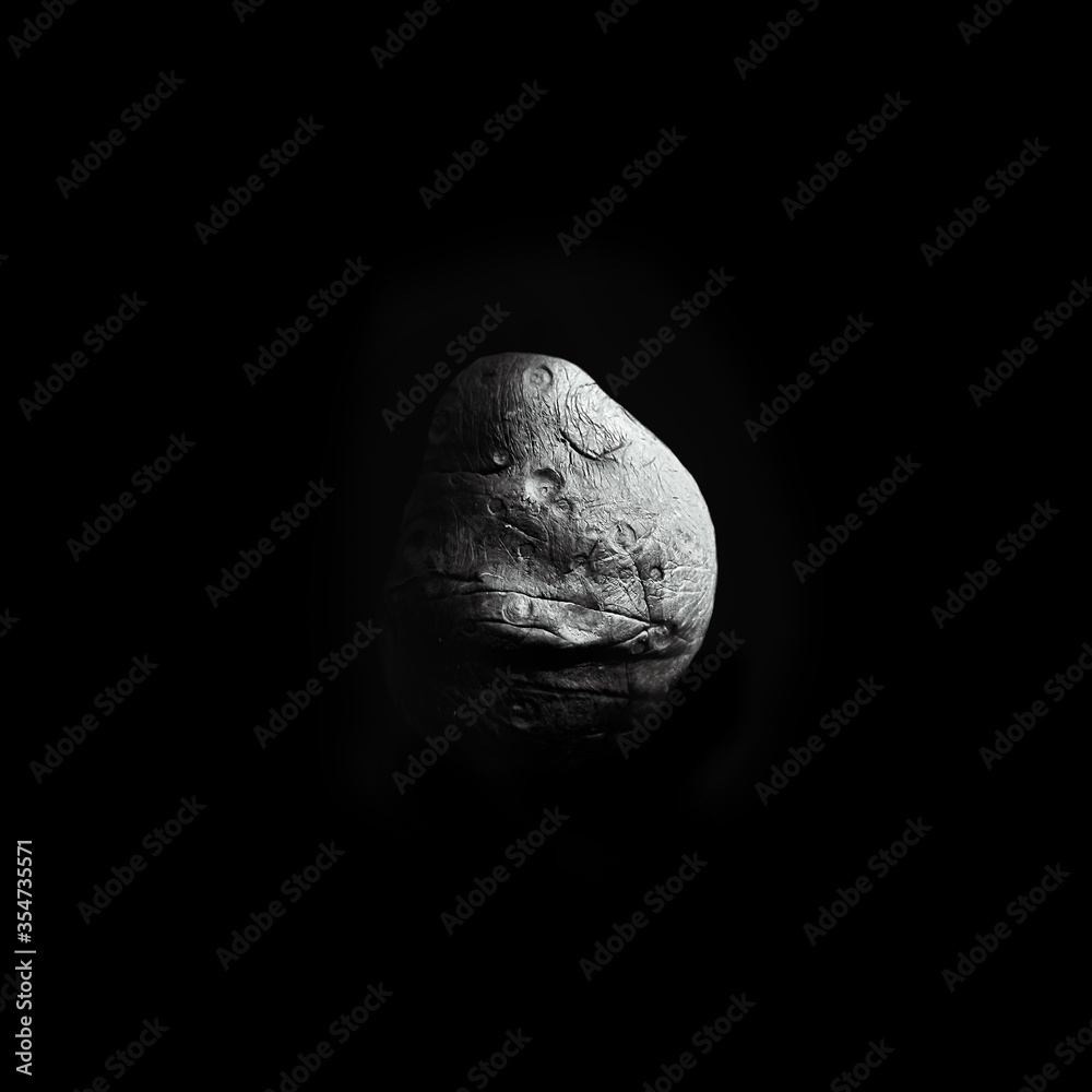 Asteroid with craters in space Asteroid with craters in space