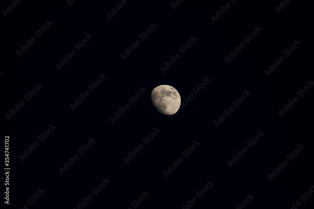 Photograph of the full big moon at night against the black sky. Astrophotography of a new moon. Photograph of the full big moon at night against the black sky. Astrophotography of a new moon.