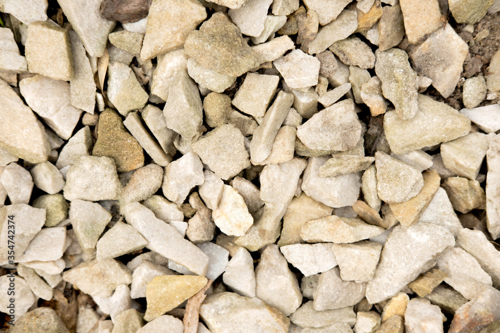 Background with light stones. The texture of the stones for design and advertising. Stones for decorating the garden