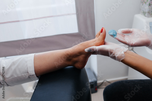 applying ointment to the foot